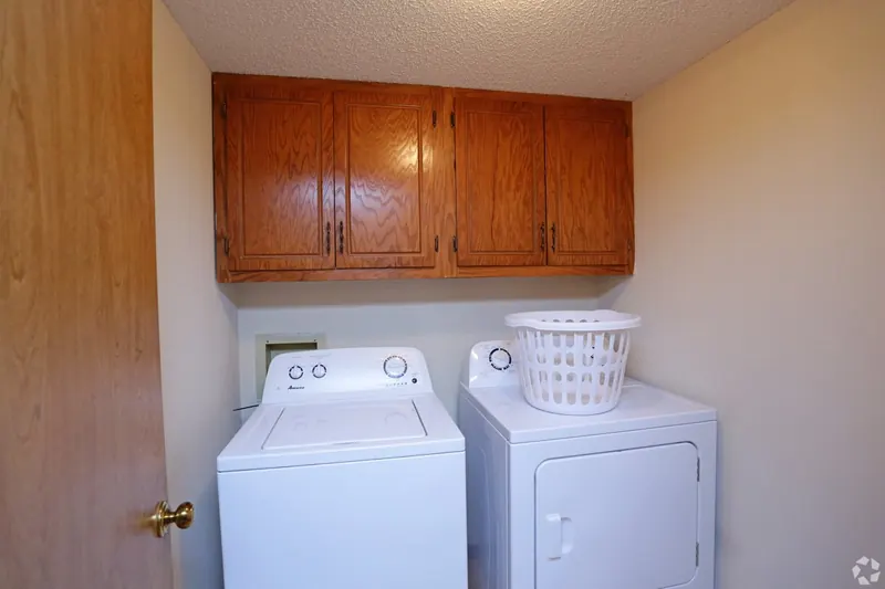 Laundry closet with a washer and dryer